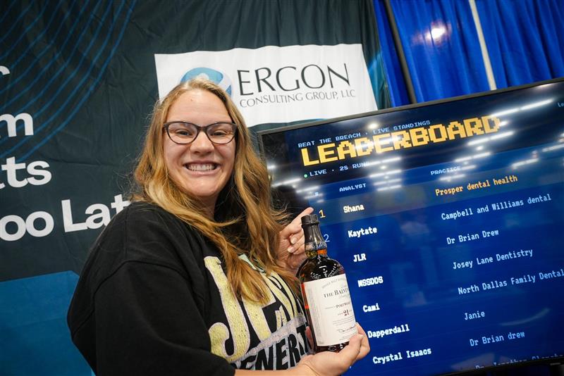 SWDC winner holding a prize at the Ergon leaderboard
